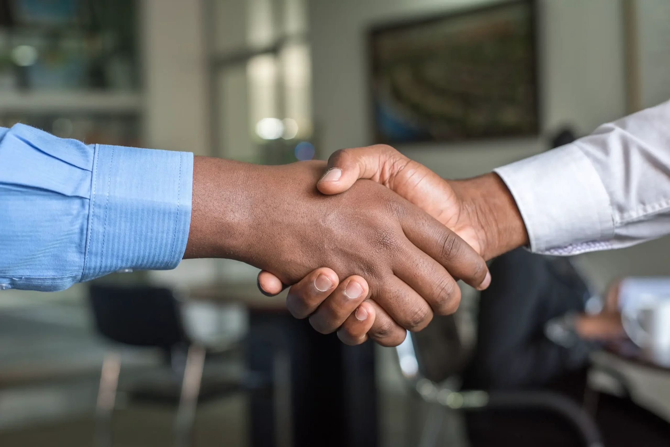 Image showing a handshake between two individuals.