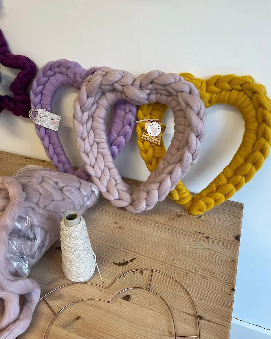 A collection of knitted heart shapes
