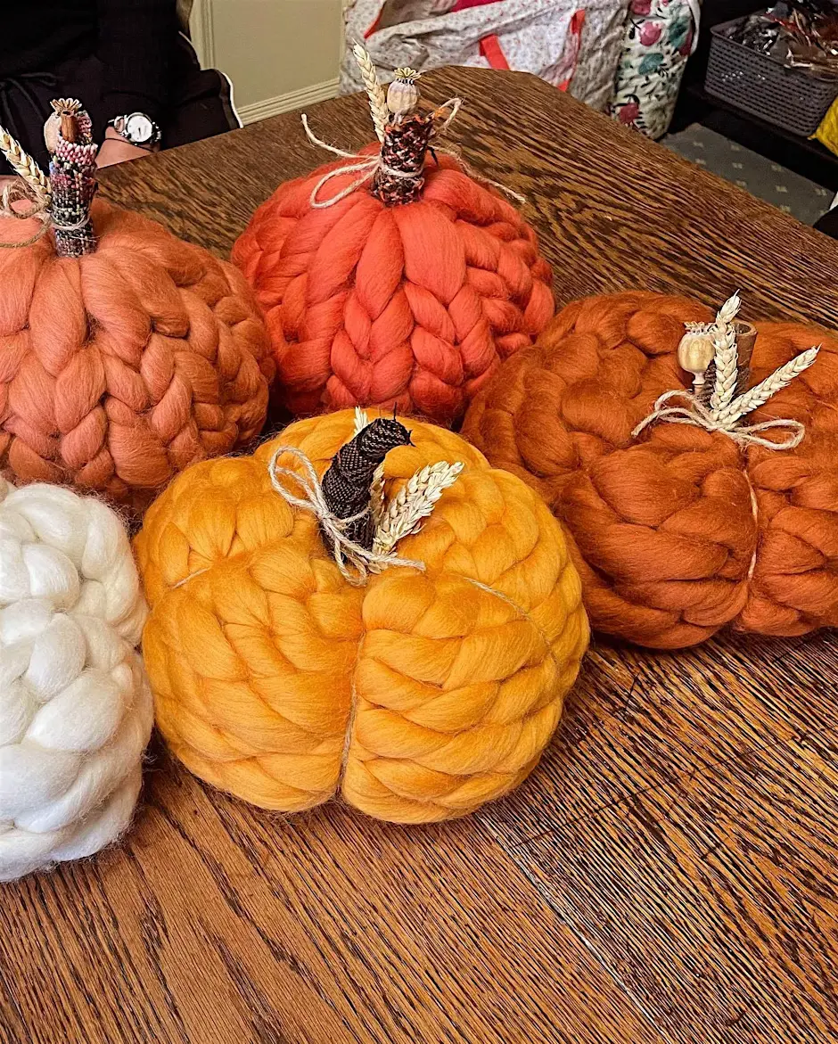 A collection of knitted pumpkins